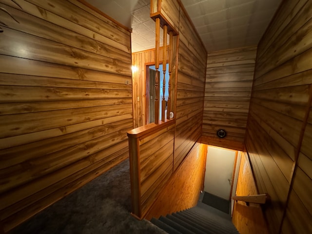 5940 Oak Rd, Rose City, MI 48654 - staircase featuring wooden walls and carpet floors