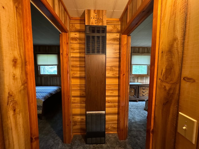 5940 Oak Rd, Rose City, MI 48654 - corridor with carpet flooring, rustic walls, and a heating unit