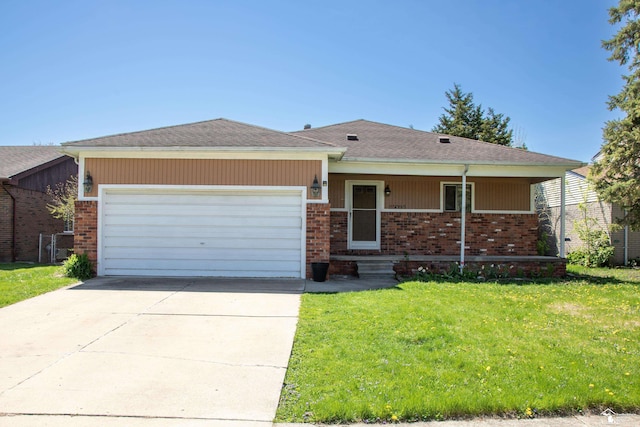 single story home with concrete driveway, an attached garage, a front yard, and brick siding