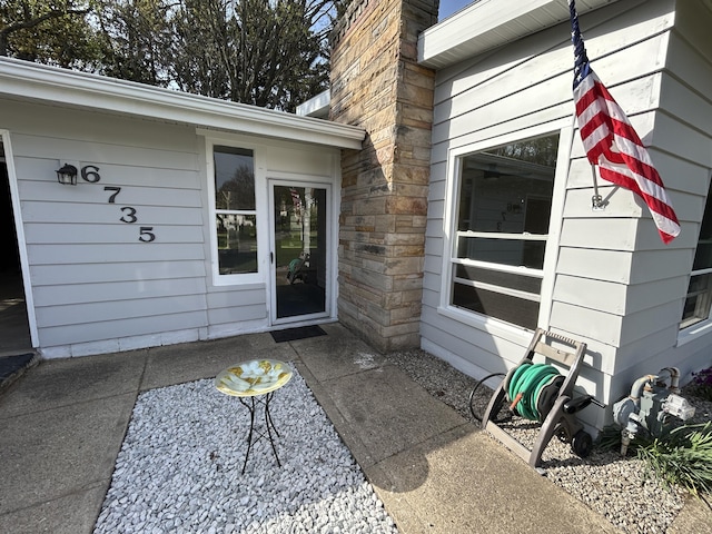 6735 Bayview Dr, Coloma, MI 49038 - doorway to property with stone siding