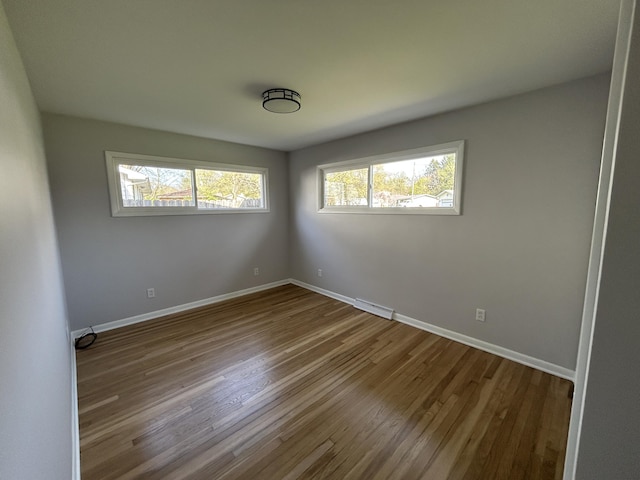 6735 Bayview Dr, Coloma, MI 49038 - unfurnished room with visible vents, baseboards, and wood finished floors