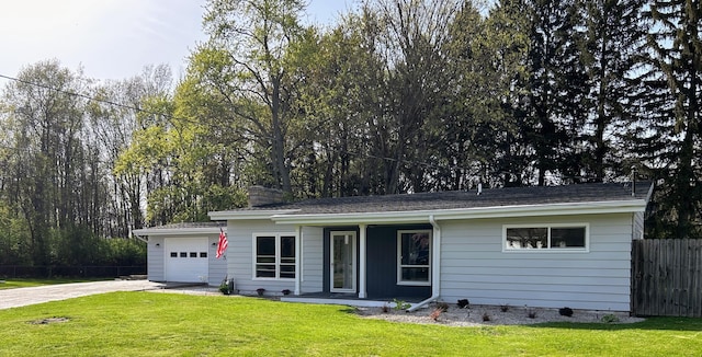 6735 Bayview Dr, Coloma, MI 49038 - ranch-style house with a garage, fence, a front yard, a porch, and driveway