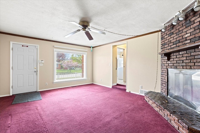 unfurnished living room with a ceiling fan, visible vents, a fireplace, ornamental molding, and carpet