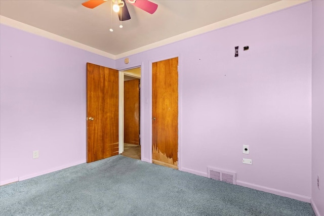 unfurnished bedroom featuring ceiling fan, carpet flooring, and visible vents