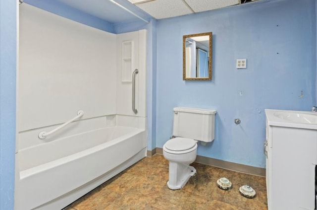 bathroom with baseboards, tub / shower combination, toilet, and vanity