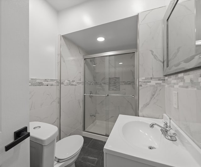 full bathroom featuring tile walls, a shower stall, vanity, toilet, and recessed lighting