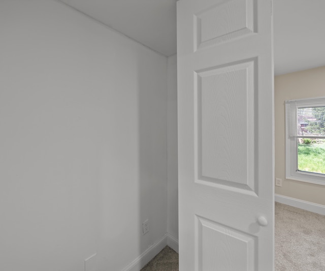 interior space featuring baseboards