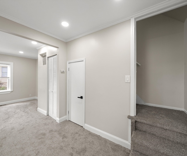interior space featuring crown molding, carpet floors, baseboards, and recessed lighting