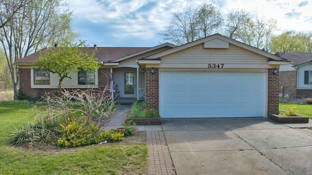 ranch-style home with brick siding, driveway, and a garage