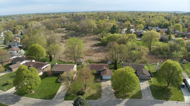 bird's eye view with a residential view and a wooded view