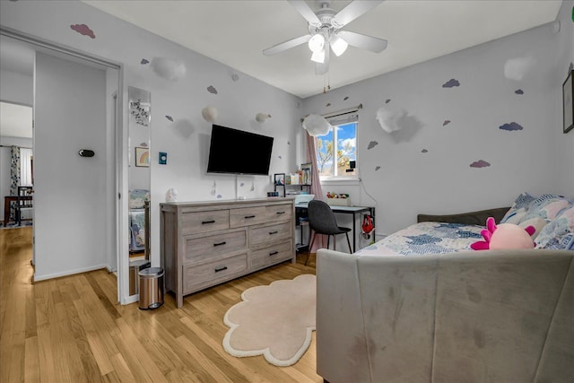 bedroom featuring a ceiling fan and light wood-type flooring