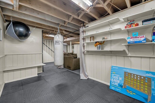 unfinished basement featuring stairway