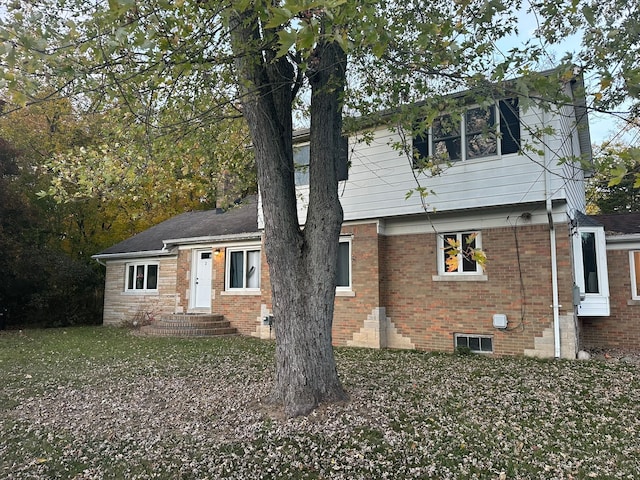 view of front of house featuring brick siding
