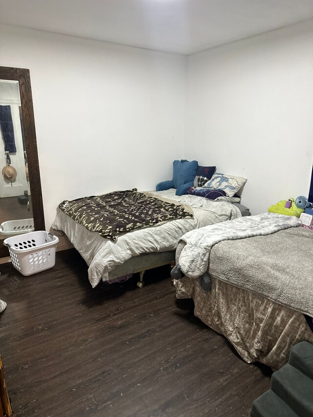 bedroom featuring wood finished floors