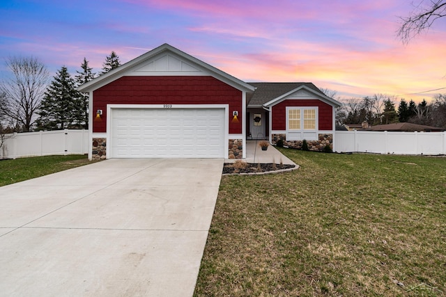 single story home with concrete driveway, a front yard, fence, and stone siding