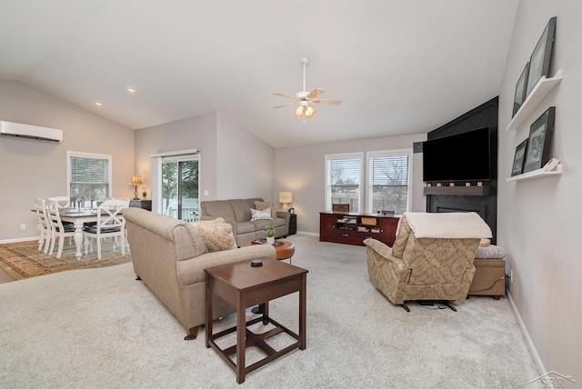 living room featuring a wall mounted air conditioner, a ceiling fan, vaulted ceiling, and a wealth of natural light