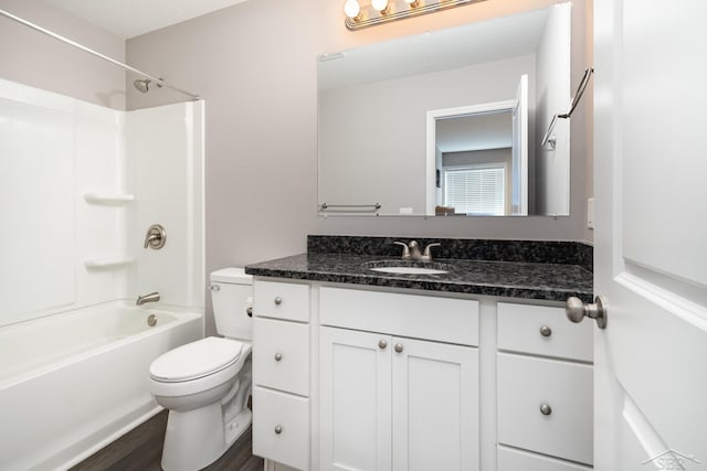 full bath featuring vanity, shower / bathtub combination, wood finished floors, and toilet