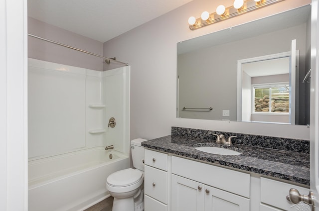 full bathroom with vanity,  shower combination, and toilet