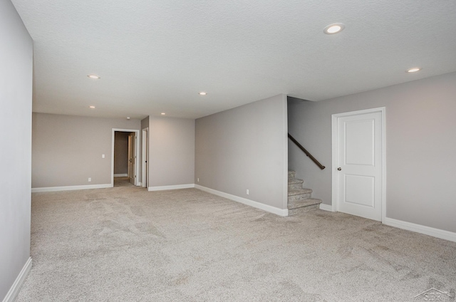interior space with recessed lighting, carpet flooring, and stairs