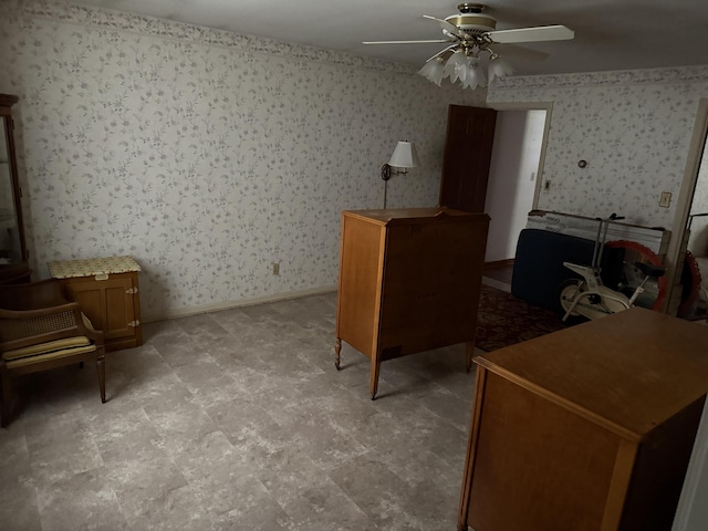 office space with ceiling fan and wallpapered walls