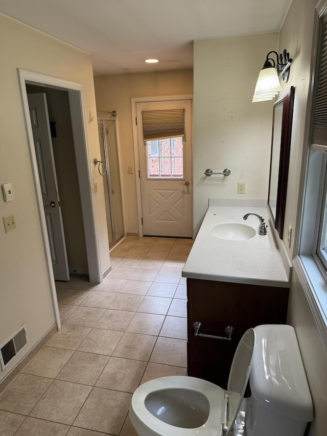6411 Custer Rd, Carsonville, MI 48419 - full bathroom with toilet, vanity, tile patterned flooring, and a stall shower