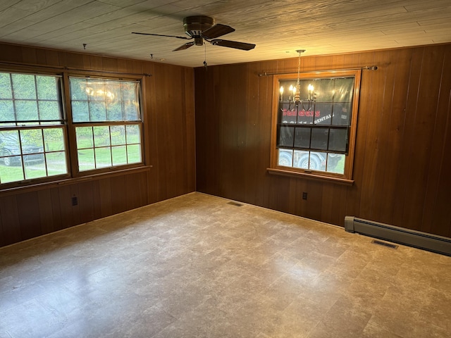 6411 Custer Rd, Carsonville, MI 48419 - empty room featuring a chandelier, tile patterned floors, a ceiling fan, wooden ceiling, and wooden walls