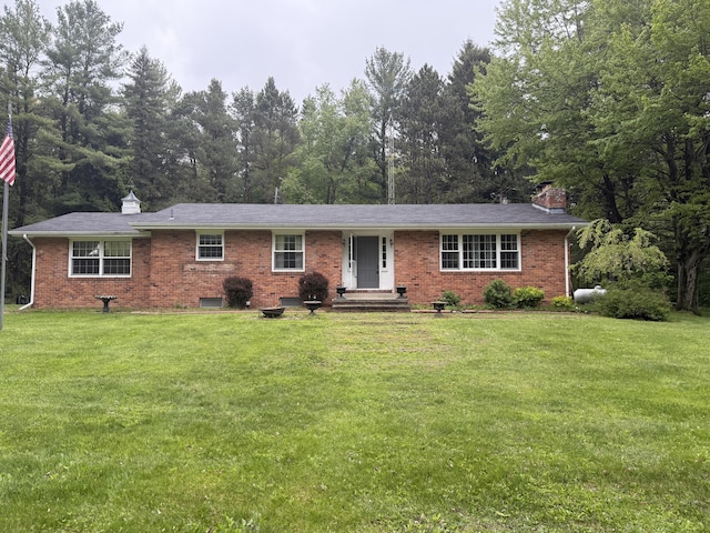6411 Custer Rd, Carsonville, MI 48419 - ranch-style home with a chimney, brick siding, and a front lawn