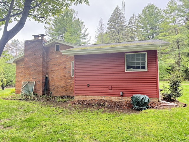 6411 Custer Rd, Carsonville, MI 48419 - view of side of property with a yard and a chimney