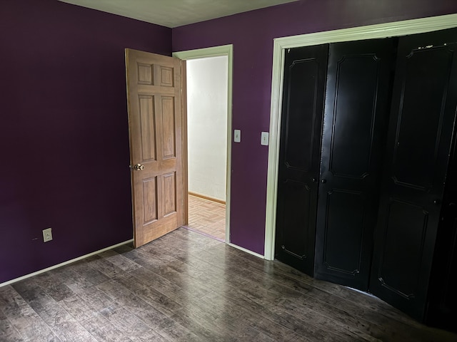 6411 Custer Rd, Carsonville, MI 48419 - unfurnished bedroom featuring wood finished floors, baseboards, and a closet
