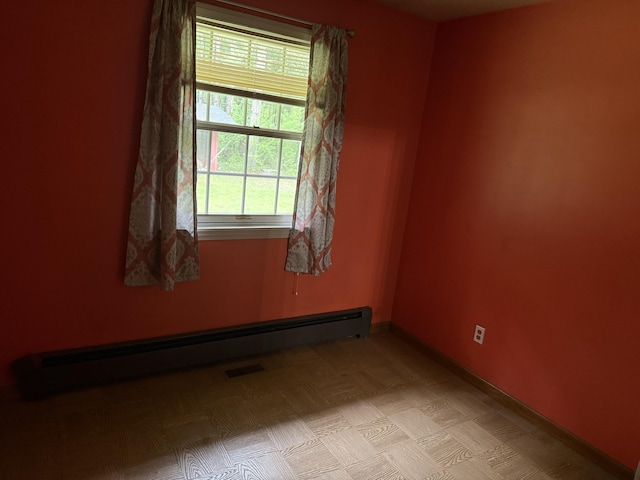 6411 Custer Rd, Carsonville, MI 48419 - empty room with a baseboard heating unit and baseboards