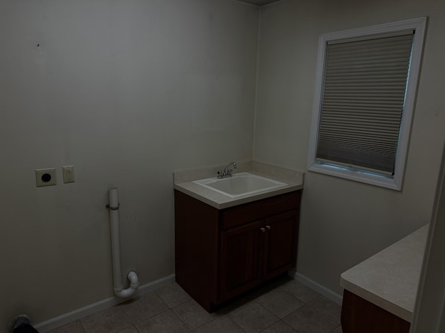 6411 Custer Rd, Carsonville, MI 48419 - bathroom featuring vanity, tile patterned flooring, and baseboards