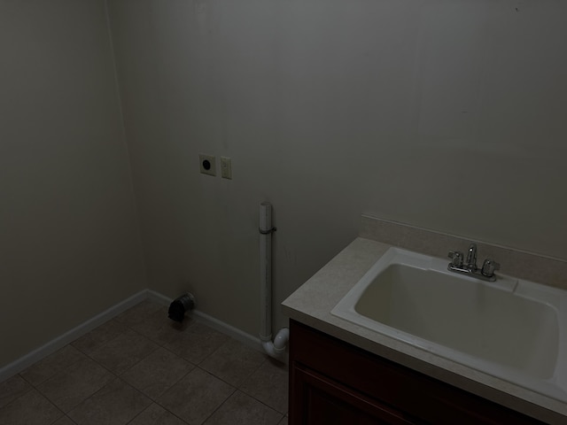 6411 Custer Rd, Carsonville, MI 48419 - laundry room with electric dryer hookup, light tile patterned floors, and baseboards