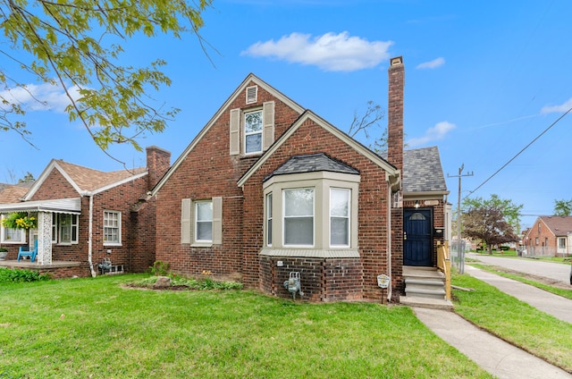 18900 Asbury Park, Detroit, MI 48235 - view of front of home with a chimney, brick siding, and a front lawn