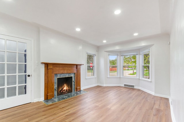 18900 Asbury Park, Detroit, MI 48235 - unfurnished living room featuring a high end fireplace, wood finished floors, visible vents, recessed lighting, and baseboards