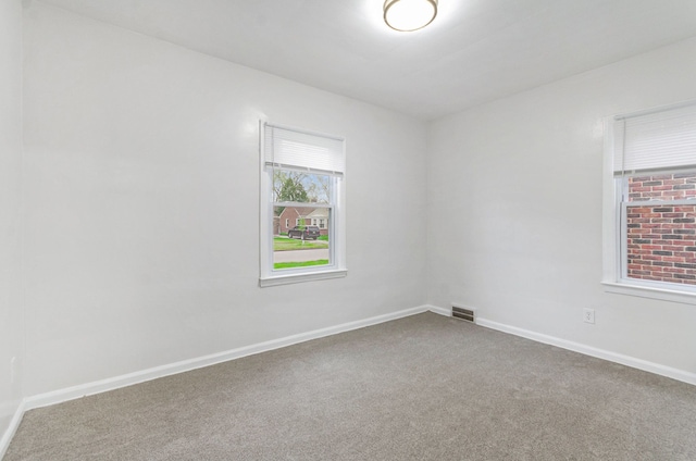 18900 Asbury Park, Detroit, MI 48235 - carpeted empty room featuring visible vents and baseboards