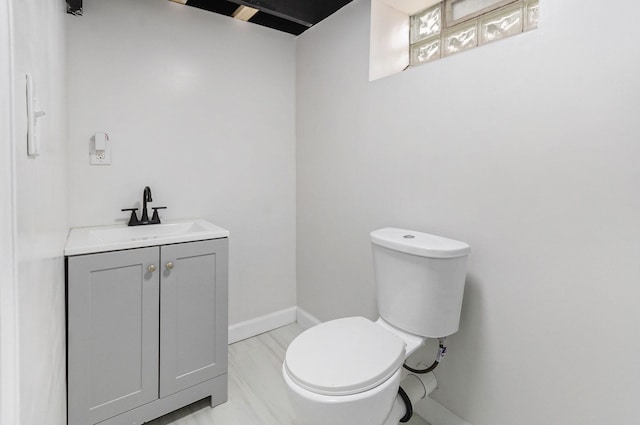 18900 Asbury Park, Detroit, MI 48235 - bathroom with vanity, toilet, and baseboards