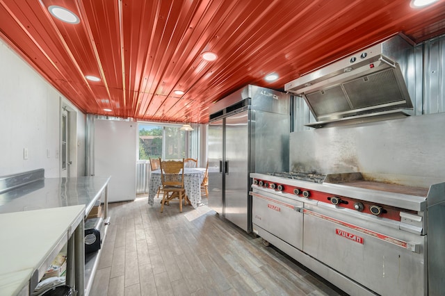 kitchen featuring recessed lighting, stainless steel built in fridge, wood finished floors, custom range hood, and wood ceiling