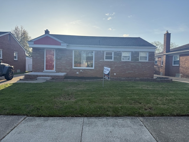 25296 Ronald St, Roseville, MI 48066 - view of front of home featuring brick siding and a front yard