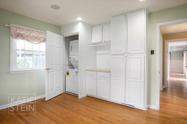 closet with stacked washer and dryer