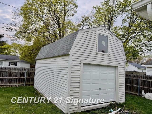 garage with fence