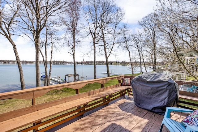 1704 Little Dr, Horton, MI 49246 - wooden deck with a water view, a boat dock, and a grill