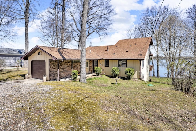 1704 Little Dr, Horton, MI 49246 - ranch-style home with a shingled roof, an attached garage, driveway, and a front yard