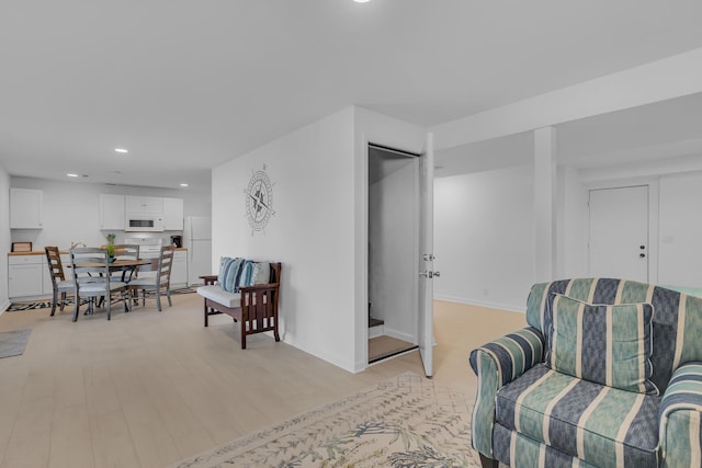 1704 Little Dr, Horton, MI 49246 - living area with recessed lighting, light wood-style flooring, and baseboards