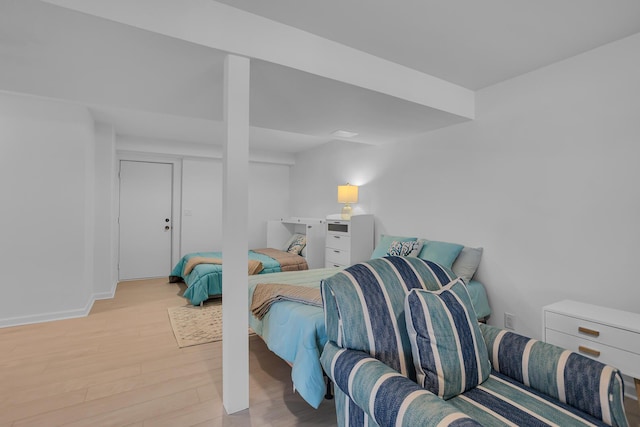 1704 Little Dr, Horton, MI 49246 - bedroom featuring baseboards and light wood-style flooring
