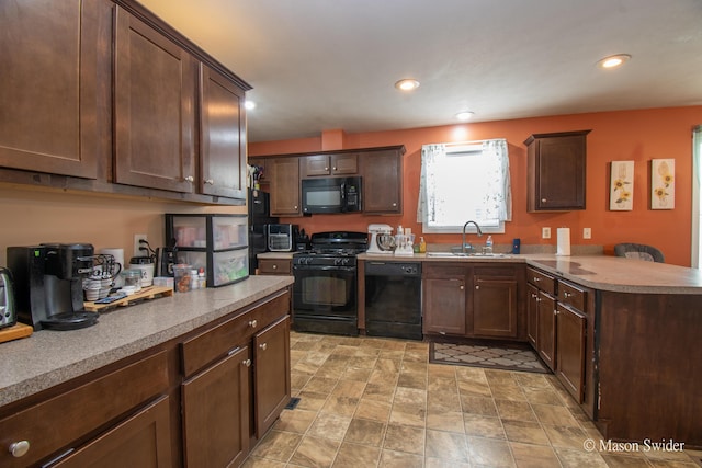 kitchen with dark brown cabinetry, a sink, a peninsula, recessed lighting, and black appliances