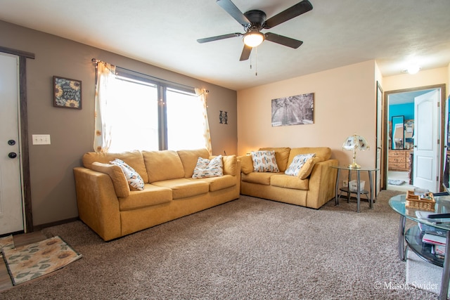 carpeted living room with a ceiling fan