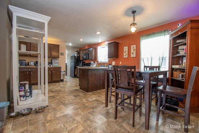 dining space with recessed lighting