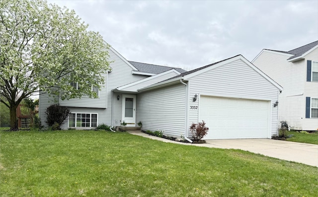 3332 Hampton Downs Dr SE, Kentwood, MI 49512 - tri-level home with roof with shingles, driveway, a front yard, and a garage