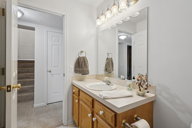 3332 Hampton Downs Dr SE, Kentwood, MI 49512 - bathroom featuring vanity and a textured ceiling