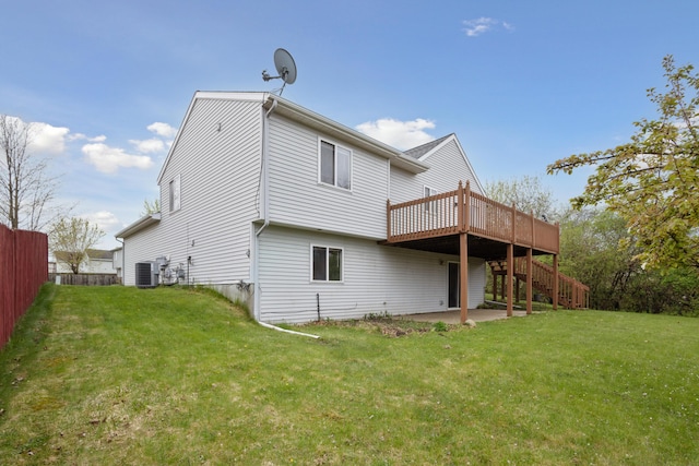3332 Hampton Downs Dr SE, Kentwood, MI 49512 - back of house with a wooden deck, fence, stairs, and a yard